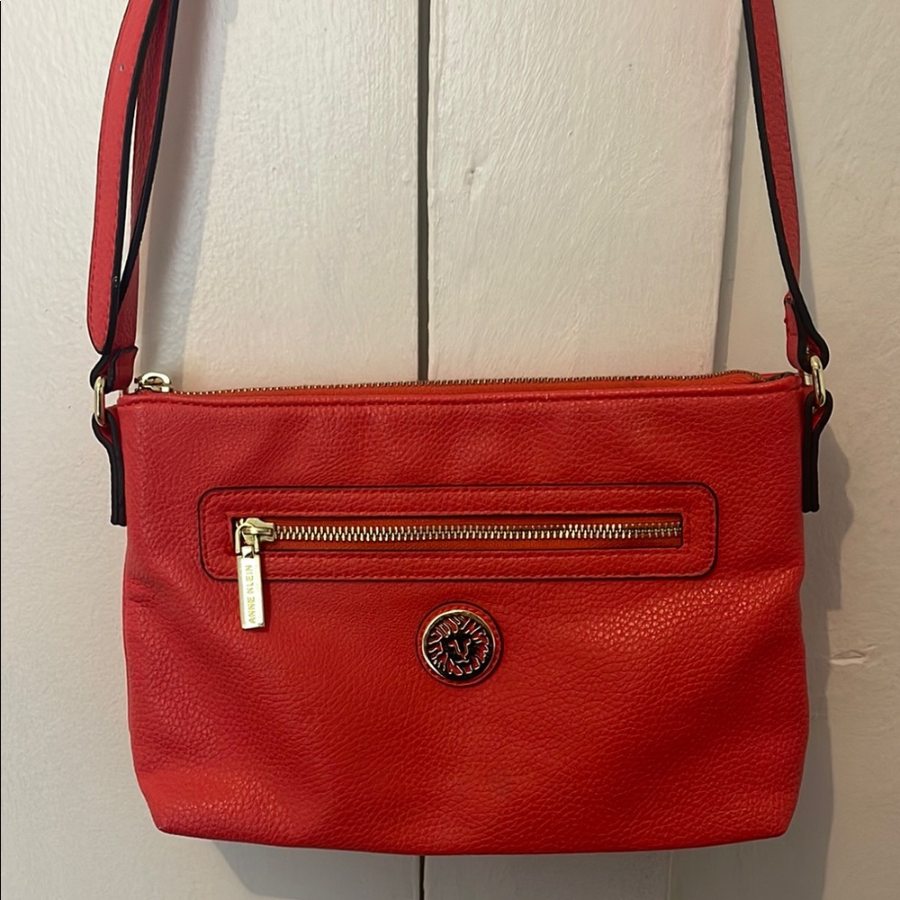 Small orange sorbet colored Anne Klein cross body bag